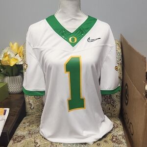 Nike Women's White Jersey with Green and Gold Accents